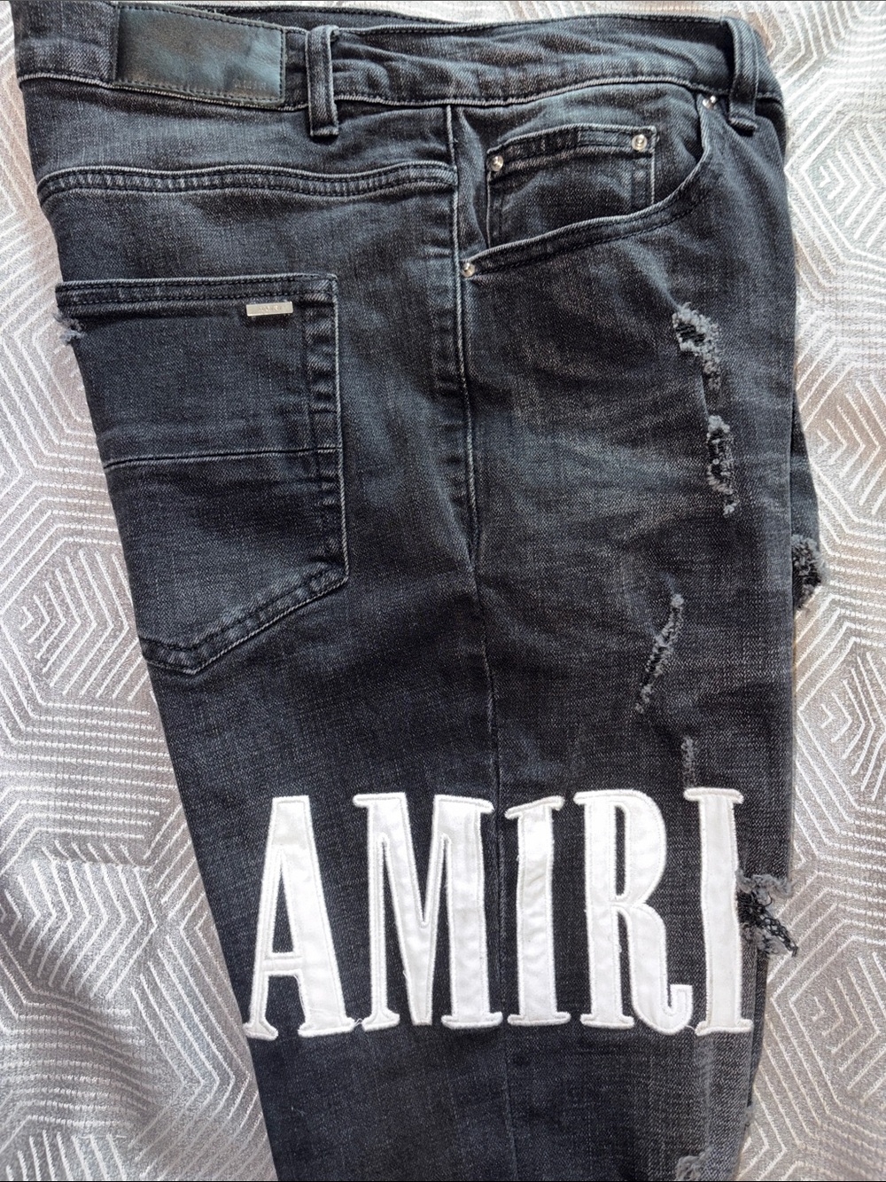 AMIRI Black Distressed Slim Men’s Jeans with White Graphic
